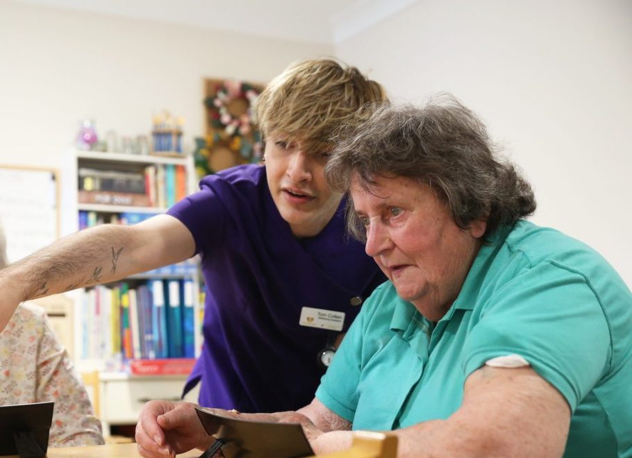 Wellbeing team lead with a resident at Cambridgeshire Care home